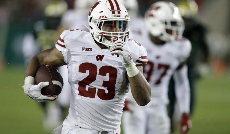 Wisconsin running back Jonathan Taylor (23) runs for a touchdown against South Florida during the second half of an NCAA college football game Friday, Aug. 30, 2019, in Tampa, Fla. (AP Photo/Chris O&#x27;Meara)