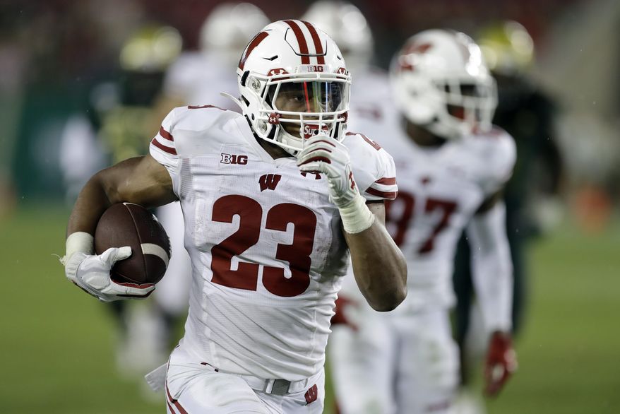 Wisconsin running back Jonathan Taylor (23) runs for a touchdown against South Florida during the second half of an NCAA college football game Friday, Aug. 30, 2019, in Tampa, Fla. (AP Photo/Chris O&#x27;Meara)