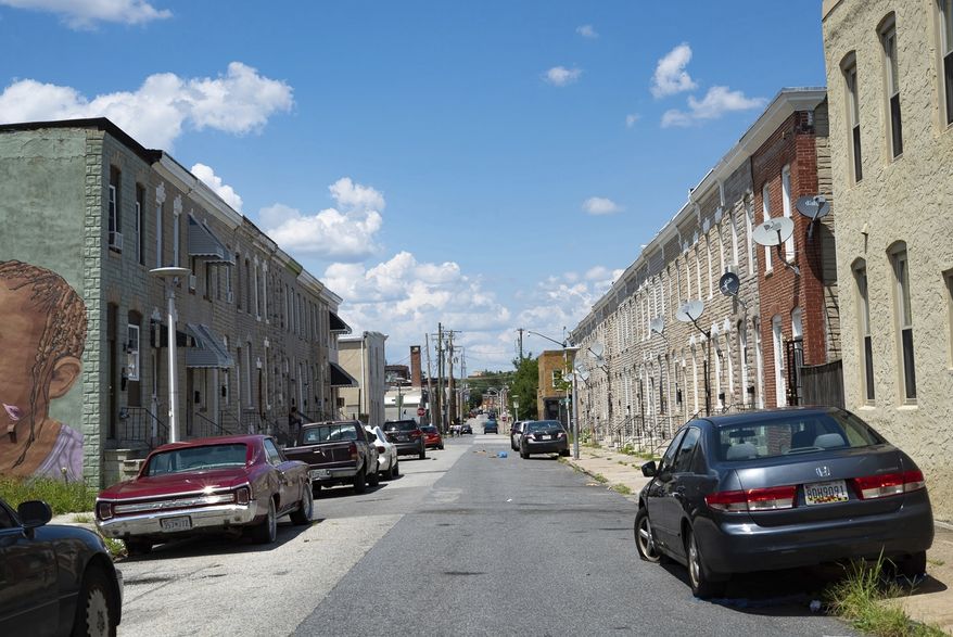 The sun beats down on a neighborhood in Baltimore. (University of Maryland Capital News Service via AP)