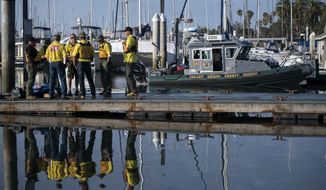 Divers with the San Luis Obispo County Sheriff&#39;s Dive Team prepare to search for a second day for missing people following a dive boat fire off Southern California&#39;s coast that killed dozens sleeping below deck, in Santa Barbara, Calif., Tuesday, Sept. 3, 2019.   (AP Photo by Christian Monterrosa )