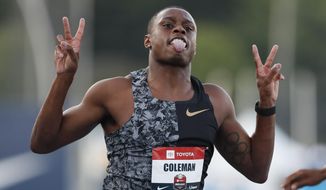FILE - In this July 26, 2019, file photo, Christian Coleman celebrates as he wins the men&#39;s 100-meter dash final at the U.S. Championships athletics meet, in Des Moines, Iowa. Star sprinter Christian Coleman will be eligible for this month’s world championships and next year’s Olympics after the U.S. Anti-Doping Agency dropped his case for missed tests because of a technicality. (AP Photo/Charlie Neibergall, File)
