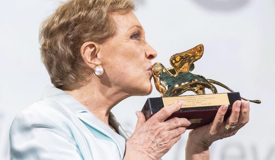 Actress Julie Andrews kisses her Golden Lion for Lifetime Achievement awarded at the 76th edition of the Venice Film Festival, Venice, Italy, Monday, Sept. 2, 2019. (Photo by Arthur Mola/Invision/AP)