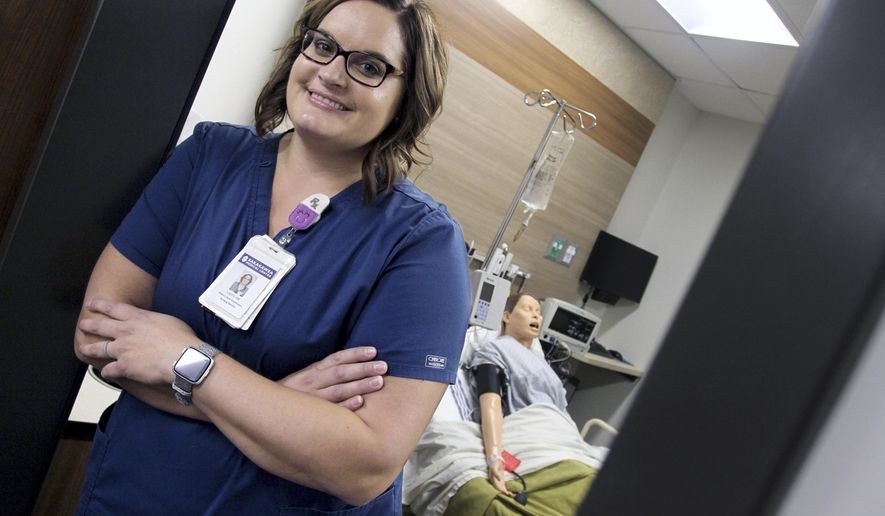 In this Aug. 27, 2019 photo, registered Nurse Lacey Johnsrud, the site instructor at the Sakakawea Medical Center, poses in in Hazen, N.D. Johnsrud prepares students to become licensed practical nurses. (Mike McCleary/The Bismarck Tribune via AP)