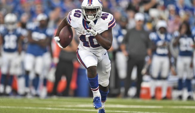 FILE - In this Aug. 8, 2019, file photo, Buffalo Bills&#x27; Devin Singletary runs the ball during the first half of an NFL preseason football game against the Indianapolis Colts, in Orchard Park, N.Y. Singletary&#x27;s encouraging performance through training camp and the preseason led to the Buffalo Bills&#x27; decision to release LeSean McCoy last weekend. Singletary will open the season at the New York Jets this weekend splitting the starting job with veteran Frank Gore.  (AP Photo/Adrian Kraus, File)