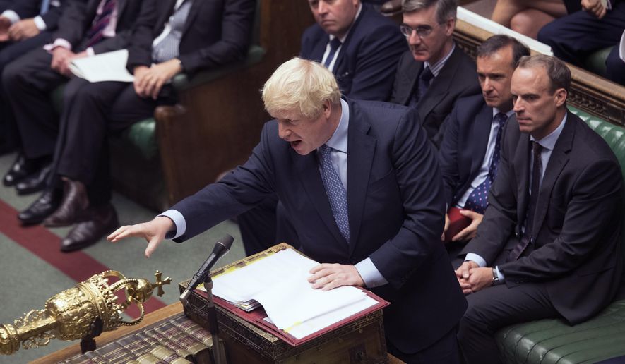 In this handout photo provided by the House of Commons, Britain's Prime Minister Boris Johnson gestures during his first Prime Minister's Questions, in the House of Commons in London, Wednesday, Sept. 4, 2019. Britain's Parliament is facing a second straight day of political turmoil as lawmakers fought Prime Minister Boris Johnson's plan to deliver Brexit in less than two months, come what may. Johnson is threatening to dissolve the House of Commons and hold a national election that he hopes might produce a less fractious crop of legislators. (Jessica Taylor/House of Commons via AP)