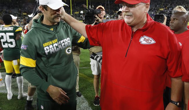 Green Bay Packers&#x27; Aaron Rodgers talks to Kansas City Chiefs head coach Andy Reid after a preseason NFL football game Thursday, Aug. 29, 2019, in Green Bay, Wis. (AP Photo/Mike Roemer)