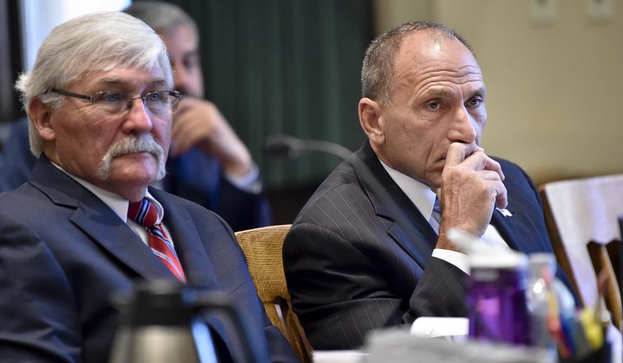 In this Tuesday, Sept. 3, 2019, photo, Gregg Trude, right, and defense attorney Greg Jackson listen to testimony during Trude's negligent homicide trial in the shooting death of Dr. Eugene "Buzz" Walton, before Judge Mike McMahon in the Lewis and Clark County Courthouse. (Thom Bridge/Independent Record via AP)