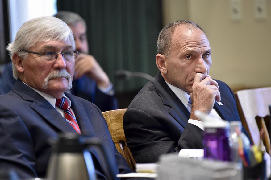 In this Tuesday, Sept. 3, 2019, photo, Gregg Trude, right, and defense attorney Greg Jackson listen to testimony during Trude's negligent homicide trial in the shooting death of Dr. Eugene "Buzz" Walton, before Judge Mike McMahon in the Lewis and Clark County Courthouse. (Thom Bridge/Independent Record via AP)