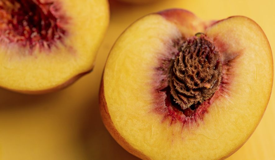 This August 2018 photo shows peaches in New York. In the last warm weeks of summer, it's hard to imagine that all of today's tomatoes and corn and peaches will be but memories in just a couple of months. With a bit of forethought, and a bit of time, we can safeguard some of this magnificent produce and draw upon it all winter long. When you preserve food, you are using techniques to stop its natural decomposition, killing or preventing the growth of microbes. (Cheyenne Cohen/Katie Workman via AP)