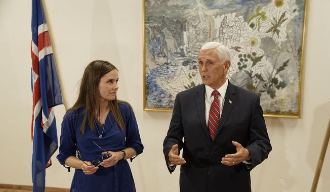 In this photo taken Wednesday, Sept.4, 2019, at Keflavik Airport, Iceland, U.S. Vice President Mike Pence meets with Iceland Prime Minister Katrin Jakobsdottir at the end of a seven hour visit to Iceland. Jakobsdottir had initially announced she would not be able to meet Pence due to a scheduling snafu but the two of them merged schedules days before Pence&#x27;s arrival. (AP Photo/Egill Bjarnason)