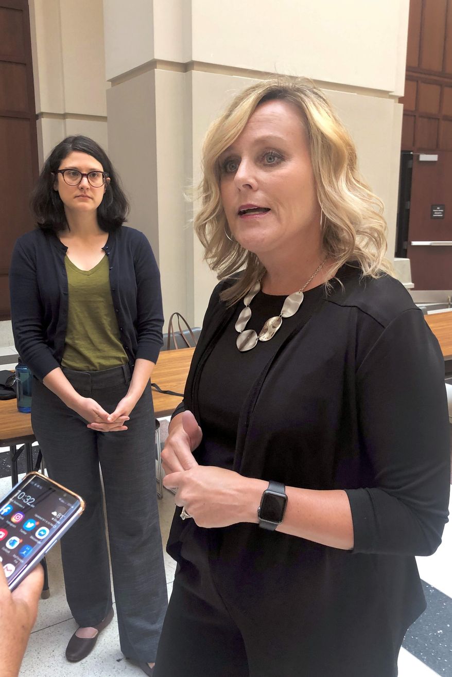 Indiana Superintendent of Public Instruction Jennifer McCormick speaks with reporters Wednesday, Sept. 4, 2019, at the state government center in Indianapolis after the release of results showing that fewer than half of Indiana students met expected achievement levels on the state's new ILEARN standardized test. (AP Photo/Tom Davies)