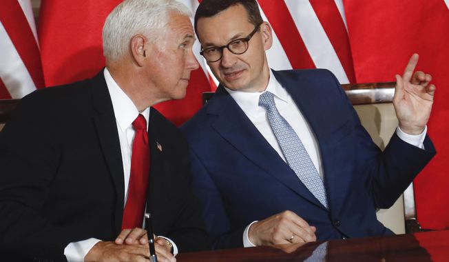 U.S. Vice President Mike Pence and Polish Prime Minister Mateusz Morawiecki, right, speak before signing an agreement in Warsaw, Poland, Monday, Sept. 2, 2019. The U.S. and Poland signed an agreement on Monday to cooperate on new 5G technology amid growing concerns about Chinese telecommunications giant Huawei. (AP Photo/Petr David Josek)