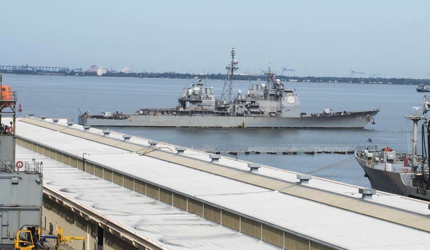 This image provided by the U.S. Navy shows the USS San Jacinto (CG-56) as it heads out of the berth at Naval Station Norfolk ahead of Hurricane Dorian in Norfolk, Va., Wednesday, Sept. 4, 2019. (Alton Dunham/US Navy via AP) ** FILE **
