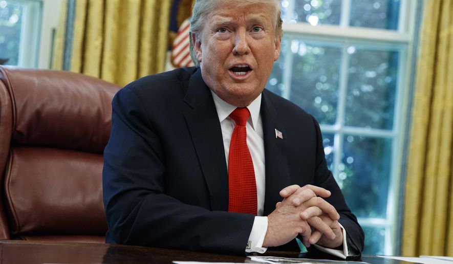 President Donald Trump talks with reporters after receiving a briefing on Hurricane Dorian in the Oval Office of the White House, Wednesday, Sept. 4, 2019, in Washington. (AP Photo/Evan Vucci)