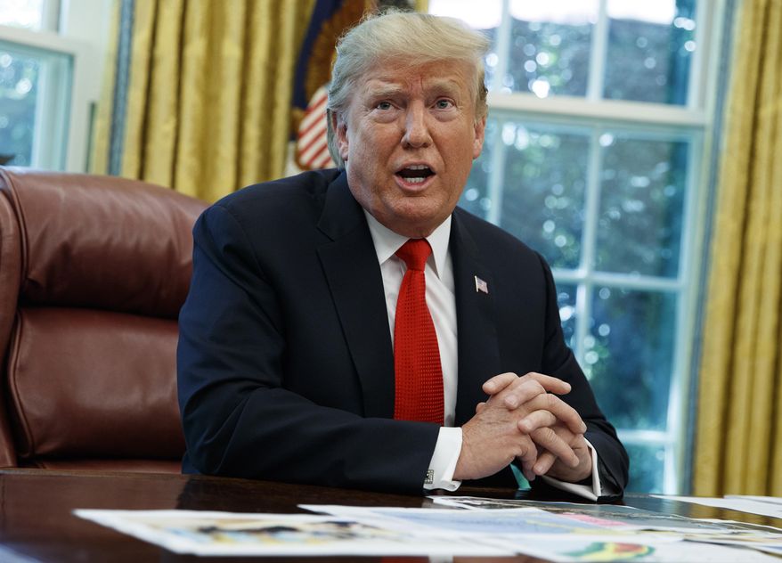 President Donald Trump talks with reporters after receiving a briefing on Hurricane Dorian in the Oval Office of the White House, Wednesday, Sept. 4, 2019, in Washington. (AP Photo/Evan Vucci)