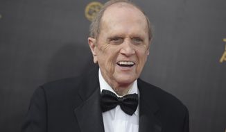 FILE - In this Sept. 10, 2016 file photo, Bob Newhart arrives at night one of the Creative Arts Emmy Awards in Los Angeles.  Newhart is celebrating his 90th birthday on Thursday, and he’s got big plans: spending the day with his wife of 56 years, Ginnie, and their children. The comedian and actor said he considers laughter the key to longevity in marriage and in life. (Photo by Richard Shotwell/Invision/AP, File)