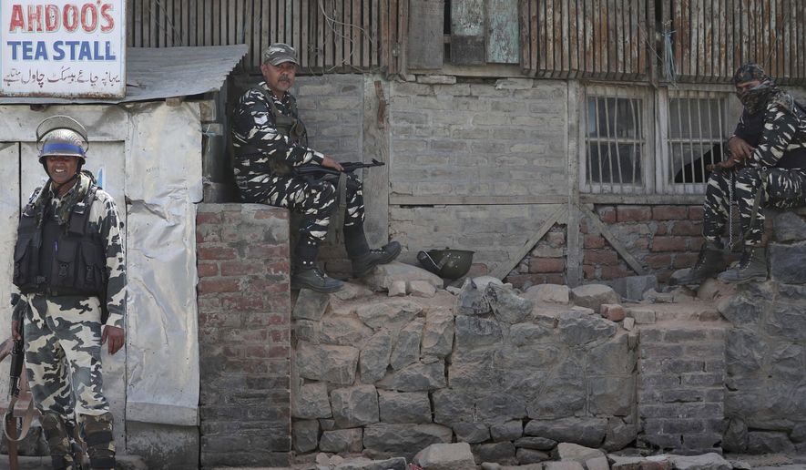 Indian paramilitary soldiers keep guard outside the main telephone exchange building in Srinagar, Indian controlled Kashmir, Thursday, Sept. 5, 2019. The Indian government stripped the Indian-administered portion of Kashmir of its limited autonomy on Aug. 5. Authorities imposed a sweeping military curfew that&#39;s still in place, and cut off residents from all communication and the internet. Mobile phone services have yet to be restored. (AP Photo/Mukhtar Khan)