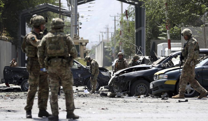 Resolute Support (RS) forces arrive at the site of a car bomb explosion in Kabul, Afghanistan, Thursday, Sept. 5, 2019. A car bomb rocked the Afghan capital on Thursday and smoke rose from a part of eastern Kabul near a neighborhood housing the U.S. Embassy, the NATO Resolute Support mission and other diplomatic missions. (AP Photo/Rahmat Gul)