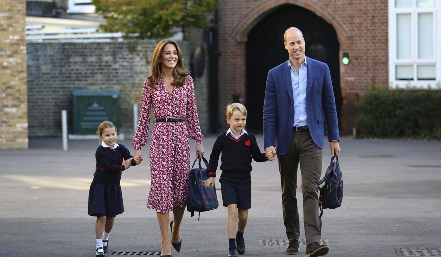 Britain's Princess Charlotte, left, with her brother Prince George and their parents Prince William and Kate, Duchess of Cambridge, arrives for her first day of school at Thomas's Battersea in London, Thursday Sept. 5, 2019. (Aaron Chown/Pool via AP)