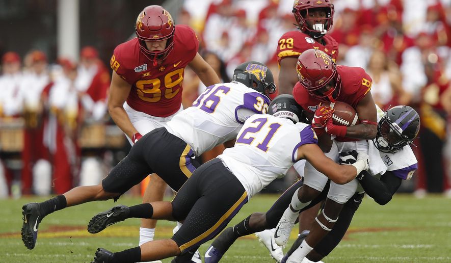 FILE - In this Aug. 31, 2019, file photo, Iowa State wide receiver Deshaunte Jones (8) is brought down by Northern Iowa's Trevon Alexander (36), Christian Jegen (21) and Spencer Perry (8) during the first half of an NCAA college football game, in Ames, Iowa. Iowa State needed triple overtime to beat Northern Iowa 29-26. (AP Photo/Matthew Putney, File)