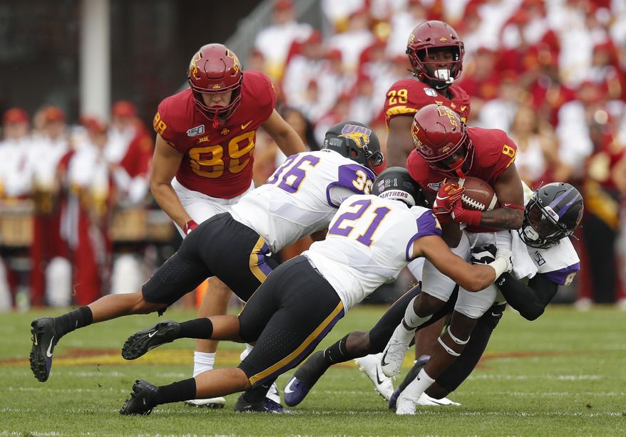 FILE - In this Aug. 31, 2019, file photo, Iowa State wide receiver Deshaunte Jones (8) is brought down by Northern Iowa's Trevon Alexander (36), Christian Jegen (21) and Spencer Perry (8) during the first half of an NCAA college football game, in Ames, Iowa. Iowa State needed triple overtime to beat Northern Iowa 29-26. (AP Photo/Matthew Putney, File)