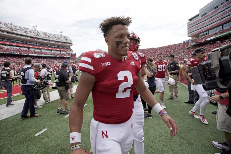 FILE - In this Aug. 31, 2019, file photo, Nebraska quarterback Adrian Martinez (2) walks off the field following a 35-21 win against against South Alabama in an NCAA college football game in Lincoln, Neb. The co-No. 25 Cornhuskers are revved up to play their old Big Eight/Big 12 rivals after a sluggish offensive performance against South Alabama. Martinez must be much better if Nebraska is going to win a road game for the first time under second-year coach Scott Frost. (AP Photo/Nati Harnik, File)