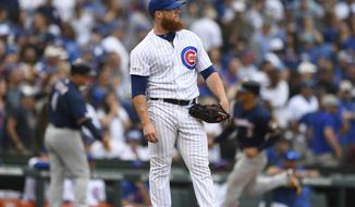 Chicago Cubs relief pitcher Craig Kimbrel watches a three-run home run hit by Milwaukee Brewers&#39; Christian Yelich during the ninth inning of a baseball game Sunday, Sept. 1, 2019, in Chicago. (AP Photo/Paul Beaty)