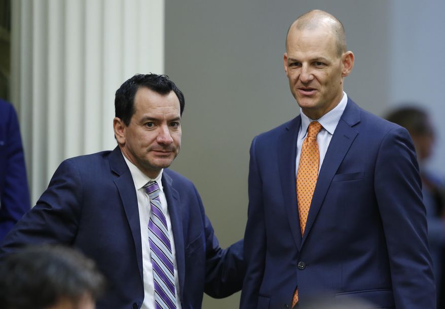 Assemblyman Kevin McCarty, D-Sacramento, right, talks with Assembly Speaker Anthony Rendon, D-Lakewood at the Capitol in Sacramento, Calif., Thursday, Sept. 5, 2019. The Assembly on Thursday approved putting McCarty's state constitutional amendment on the November 2020 ballot. If approved, it would allow convicted felons who are on parole the right to vote. The measure now goes to the Senate. (AP Photo/Rich Pedroncelli)