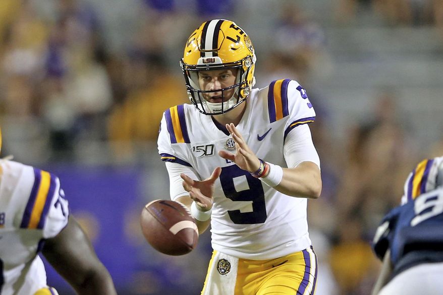 LSU quarterback Joe Burrow (9) takes a snap during the third quarter of the team's NCAA football game against Georgia Southern in Baton Rouge, La., Saturday, Aug. 31, 2019. Burrow tied an LSU single-game record with five touchdown passes before halftime. (AP Photo/Michael Democker)