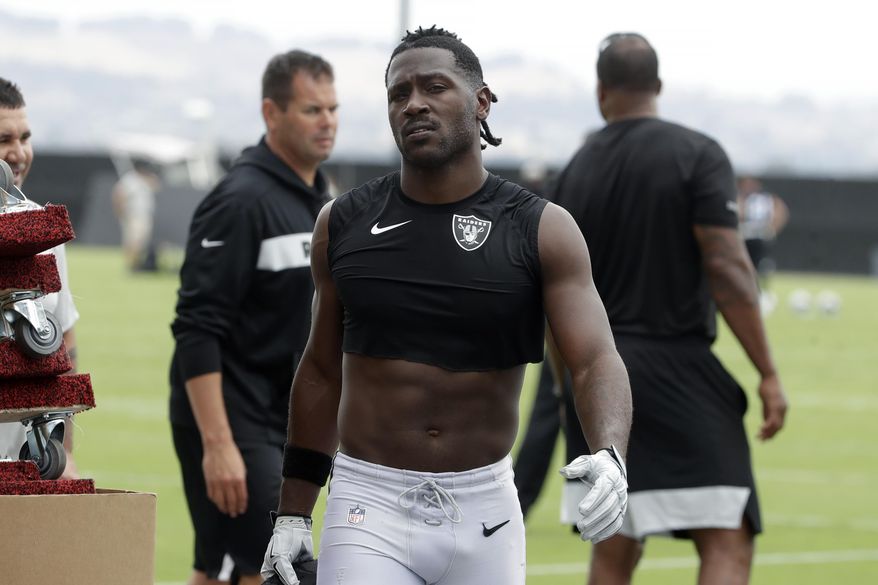 FILE - In this Aug. 20, 2019, file photo, Oakland Raiders&#x27; Antonio Brown walks off the field after NFL football practice in Alameda, Calif. Star receiver Antonio Brown is not with the Oakland Raiders four days before the season opener amid reports he could be suspended over a confrontation with general manager Mike Mayock.Mayock issued a brief statement at the beginning of practice Thursday, Sept. 5, 2019, saying that Brown wasn&#x27;t at the Raiders facility and won&#x27;t be practicing a day after Brown posted a letter from the GM on social media detailing nearly $54,000 in fines. (AP Photo/Jeff Chiu, File)