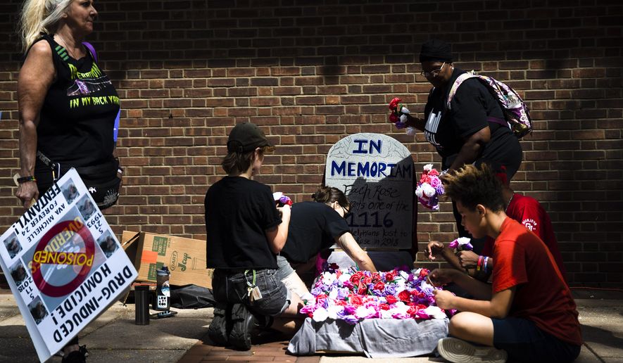 Protesters assemble a makeshift memorial to those lost to drug overdoses last year during a demonstration in support of a proposed supervised injection site, outside the federal courthouse in Philadelphia, Thursday, Sept. 5, 2019. U.S. Attorney William McSwain believes the plan to open a supervised injection site violates the federal Controlled Substances Act and wants a federal judge to declare it illegal before it opens.
(AP Photo/Matt Rourke)