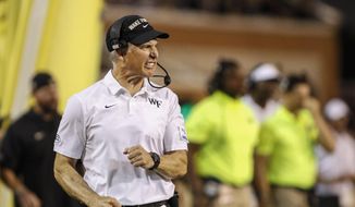 Wake Forest head coach Dave Clawson reacts on the sideline as his team plays against Utah State in the first half of an NCAA college football game in Winston-Salem, N.C., Friday, Aug. 30, 2019. (AP Photo/Nell Redmond)