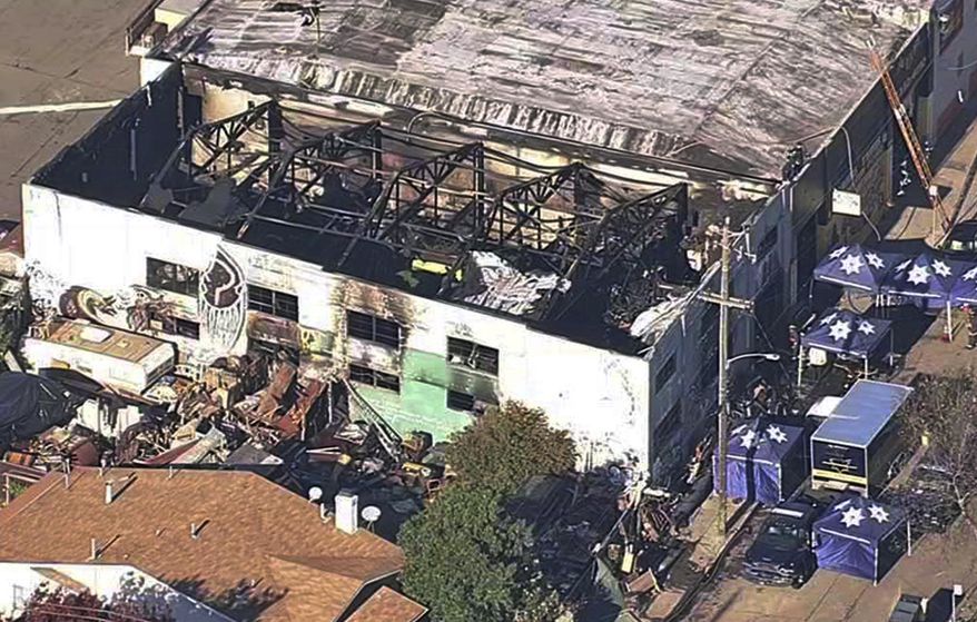 FILE - This Dec. 3, 2016, file image from video provided by KGO-TV shows the Ghost Ship Warehouse after a fire swept through the building in Oakland, Calif. A jury has decided the fate of two men charged with involuntary manslaughter after prosecutors say they turned a San Francisco Bay Area warehouse into a cluttered maze that trapped 36 partygoers during a fast-moving fire. The verdicts for Derick Almena and Max Harris will be announced Thursday, Sept. 5, 2019, after a three-month trial that drew family and friends of the victims to a packed courtroom, said Almena's attorney, Brian Getz. They face up to 39 years in prison if convicted. (KGO-TV via AP, File)