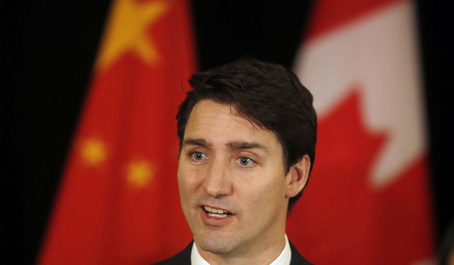 Canadian Prime Minister Justin Trudeau speaks to the media at a hotel in Beijing, China. (AP Photo/Ng Han Guan, File)