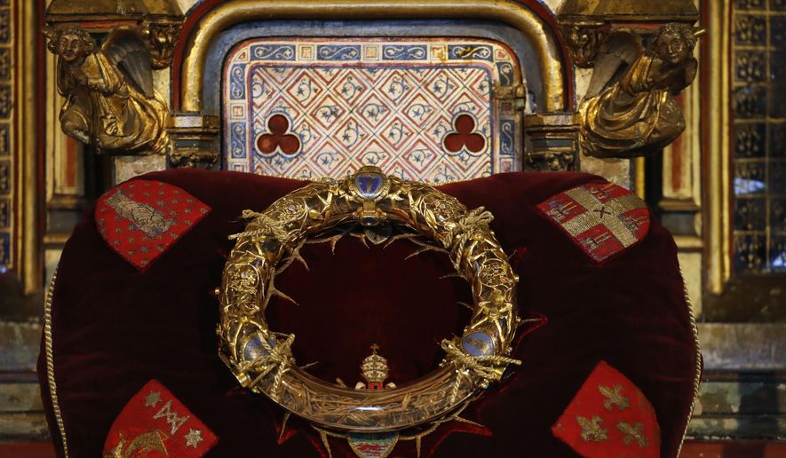 CAPTION CORRECTS THE SECOND LINE - The Crown of Thorns relic is on display during a ceremony in St Germain l'Auxerrois church, in Paris, Friday, Sept. 6, 2019. The Crown of Thorns relic, saved from the flames at Notre Dame Cathedral, has been presented to the public in Paris. In a rare occasion, a veneration of the crown took place Friday at St Germain l’Auxerrois church. It was only the second time the relic was removed from the safe at the Louvre museum when it is now preciously kept. (AP Photo/Christophe Ena)