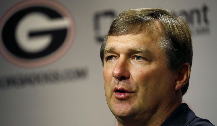 FILE - In this Aug. 2, 2019, file photo, Georgia head coach Kirby Smart speaks to reporters before the team's first scheduled NCAA college football practice Athens, Ga. The Bulldogs shouldn't have to worry about too much crowd noise, even in a rare road opener. Their fans are combining the Labor Day holiday weekend with a popular trip to Nashville, so No. 3 Georgia should have plenty of fans in red Saturday night when they play Vanderbilt in the Southeastern Conference opener for both teams. (AP Photo/John Bazemore, File)