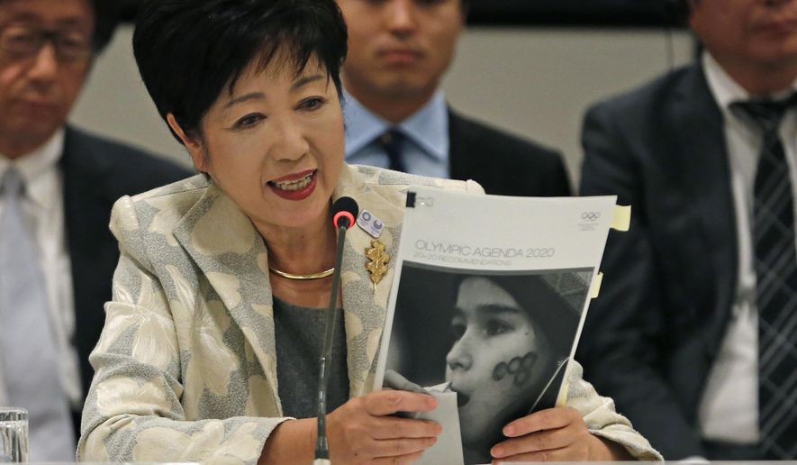 FILE - In this Nov. 29, 2016, file photo, Tokyo Gov. Yuriko Koike speaks at the IOC debriefing meeting in Tokyo. Japan wants to start using the traditional order for Japanese names in English in official documents, with family names first, a switch from the Westernized custom the country adopted more than a century ago. (AP Photo/Shuji Kajiyama, File)