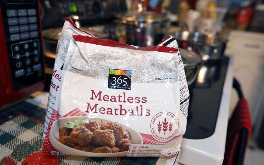 File-This July 2, 2019, file photo shows a bag of "meatless meatballs". Mississippi is considering new rules that let companies continue to use food-labeling terms such as “veggie burger” and “vegan bacon,” as long as the terms are prominently displayed so consumers understand the products are not meat. The state agriculture department on Thursday, Sept. 5, 2019, proposed new regulations for plant-based products that are sold as alternatives to meat. The regulations came in response to a lawsuit filed by a nonprofit organization advocating plant-based foods and an Illinois food company. The lawsuit was filed on July 1, the same day the state enacted a law dictating that "a plant-based or insect-based food product shall not be labeled as meat or a meat food product." (AP Photo/Rogelio V. Solis, File)