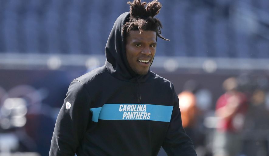 FILE - In this Aug. 8, 2019, file photo, Carolina Panthers' Cam Newton walks across the field before an NFL preseason football game against the Chicago Bears in Chicago. The Los Angeles Rams play at the Carolina Panthers on Sunday. (AP Photo/Charles Rex Arbogast, File)