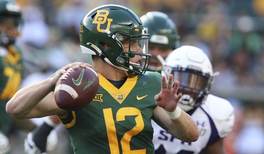 FILE - In this Aug. 31, 2019, file photo, Baylor quarterback Charlie Brewer throws downfield against Stephen F. Austin in the first half of an NCAA college football game, in Waco, Texas. Charlie Brewer is finally entrenched as Baylor’s quarterback in his third season starting games. Frank Harris, also a touted dual-threat recruit as a Texas high school senior three years ago, is just getting started at UTSA. (Rod Aydelotte/Waco Tribune-Herald via AP, File)