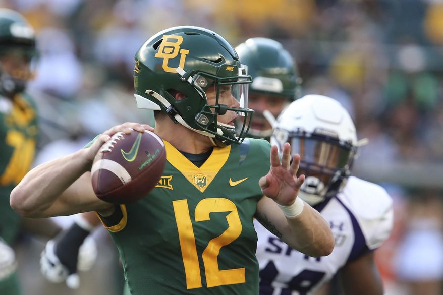 FILE - In this Aug. 31, 2019, file photo, Baylor quarterback Charlie Brewer throws downfield against Stephen F. Austin in the first half of an NCAA college football game, in Waco, Texas. Charlie Brewer is finally entrenched as Baylor’s quarterback in his third season starting games. Frank Harris, also a touted dual-threat recruit as a Texas high school senior three years ago, is just getting started at UTSA. (Rod Aydelotte/Waco Tribune-Herald via AP, File)