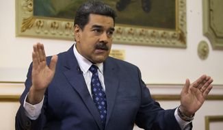 In this Feb. 14, 2019, file photo, Venezuela&#39;s President Nicolas Maduro speaks during an interview with The Associated Press at Miraflores presidential palace in Caracas, Venezuela. Maduro ordered on Tuesday, Sept. 3, 2019, Venezuela&#39;s military to hold exercises along the border with Colombia, accusing the neighboring nation&#39;s president of plotting an attack as tensions mount between the two South American countries. (AP Photo/Ariana Cubillos, File)