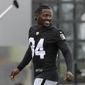 In this Aug. 20, 2019 file photo, Oakland Raiders&#x27; Antonio Brown smiles before stretching during NFL football practice in Alameda, Calif.  Brown was released by the Raiders,  Saturday, Sept. 7, 2019.  (AP Photo/Jeff Chiu, File) **FILE**