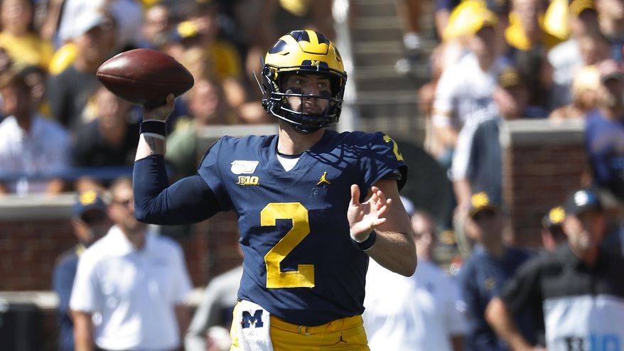 Michigan quarterback Shea Patterson throws against Army in the first half of an NCAA college football game in Ann Arbor, Mich., Saturday, Sept. 7, 2019. (AP Photo/Paul Sancya)