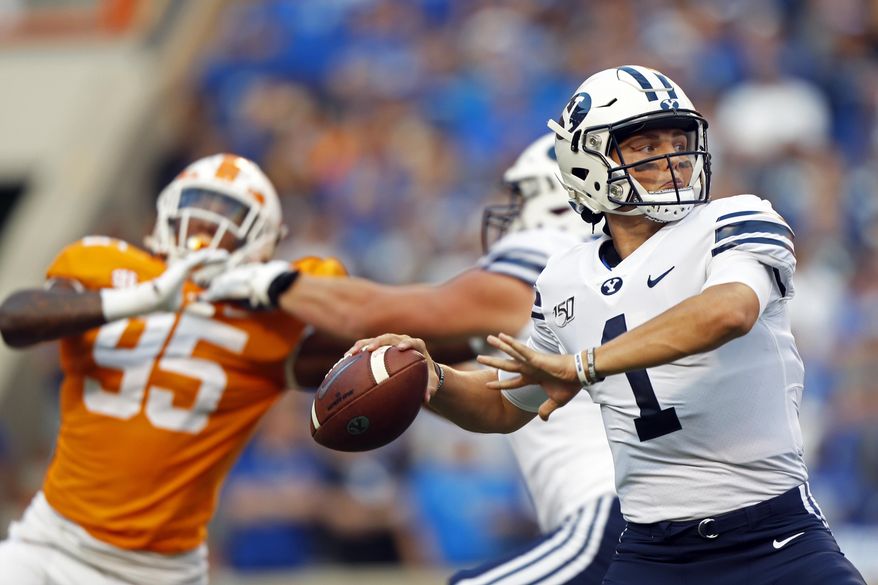 Brigham Young quarterback Zach Wilson (1) throws to a receiver in the first half of an NCAA college football game against Tennessee Saturday, Sept. 7, 2019, in Knoxville, Tenn. (AP Photo/Wade Payne)