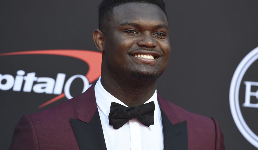 FILE - In this July 10, 2019 file photo, Zion Williamson, of the Duke University Basketball team, arrives at the ESPY Awards at the Microsoft Theater in Los Angeles. Duke says an investigation has found no evidence that Williamson received improper benefits. School spokesman Michael Schoenfeld said in a statement Saturday, Sept. 7, that a "thorough and objective" probe led by investigators outside the athletic department found "no evidence to support any allegation" that would have jeopardized Williamson's eligibility. (Photo by Jordan Strauss/Invision/AP, File)