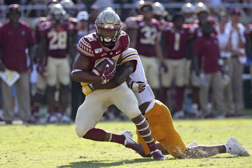 Florida State's Tre'Shaun Harrison, left, is tackled by Louisiana-Monroe's Keilos Swinney in the first quarter of an NCAA college football game Saturday, Sept. 7, 2019 in Tallahassee Fla. (AP Photo/Steve Cannon)v