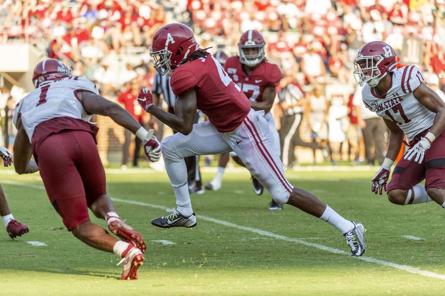 Alabama wide receiver Jerry Jeudy (4) runs a pass reception win for a 19-yard touchdown against New Mexico State during the second half of an NCAA college football game Saturday, Sept. 7, 2019, in Tuscaloosa, Ala. (AP Photo/Vasha Hunt)