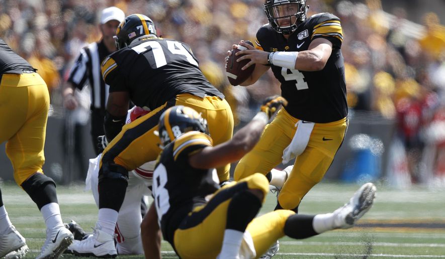 Iowa quarterback Nate Stanley runs the ball against Rutgers during the second half of an NCAA college football game, Saturday, Sept. 7, 2019, in Iowa City. Iowa won 30-0. (AP Photo/Matthew Putney)