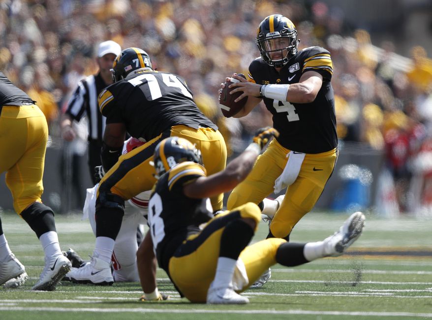 Iowa quarterback Nate Stanley runs the ball against Rutgers during the second half of an NCAA college football game, Saturday, Sept. 7, 2019, in Iowa City. Iowa won 30-0. (AP Photo/Matthew Putney)